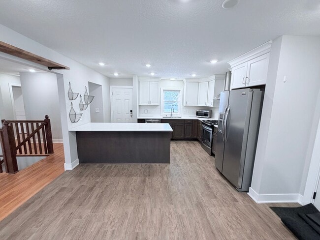 Building Photo - Spacious 4-Bedroom Home with Pond Views & EV-Ready Garage – Bloomington!!