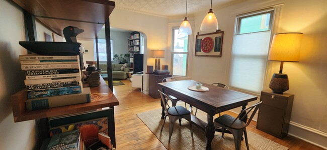 Large dining room with vintage tin ceilings. - 1023 28th Ave NE