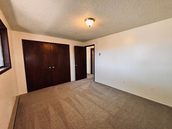 Building Photo - Single-Level 2 Bedroom / 1 Bath Triplex Unit on 1/2 Acre in East Bend  -  Move-In Special * up to...