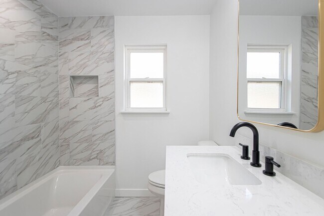 Building Photo - Large Open-Concept 4 Bedroom with Stunning Pond Views!