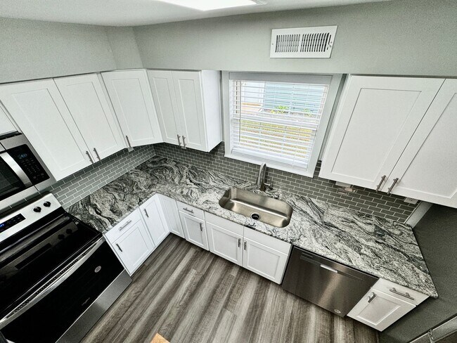 Building Photo - Updated & Ready For You On 12-05-25! A Pet-Friendly Home w/Attached Garage, All Appliances Convey...