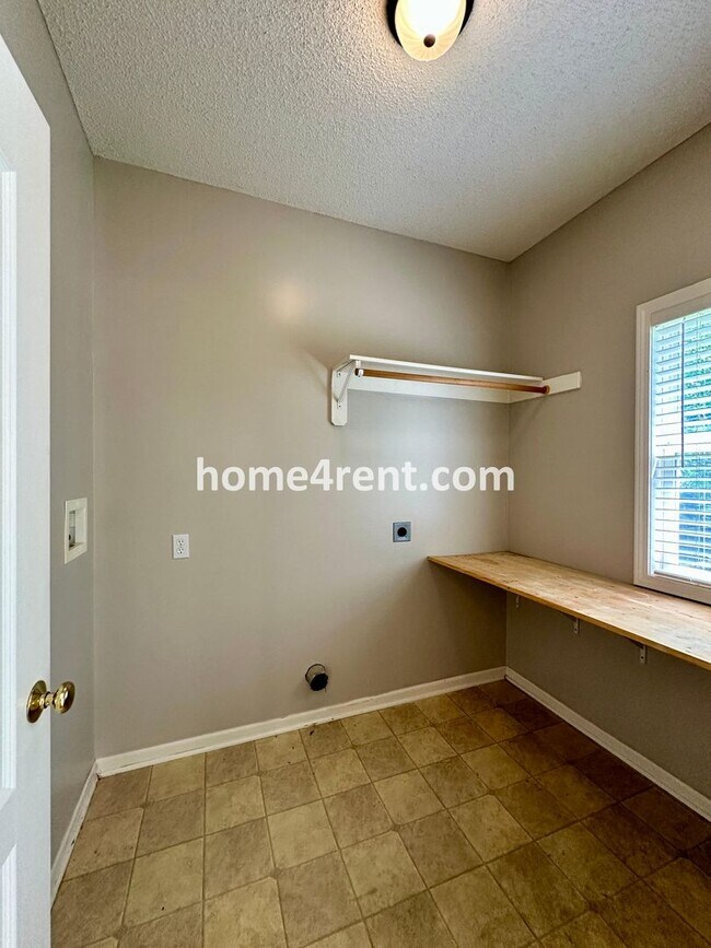 Building Photo - Beautiful Four-Bedroom Home with Three Car...