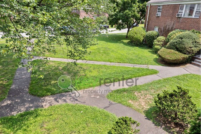 Building Photo - Quiet 2nd-Floor 1BR Condo – Updated Bath, Pet Friendly & Easy NYC Commute
