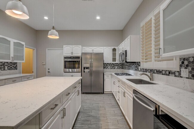 Building Photo - 4 bedroom, 3-bath home with a Pool!