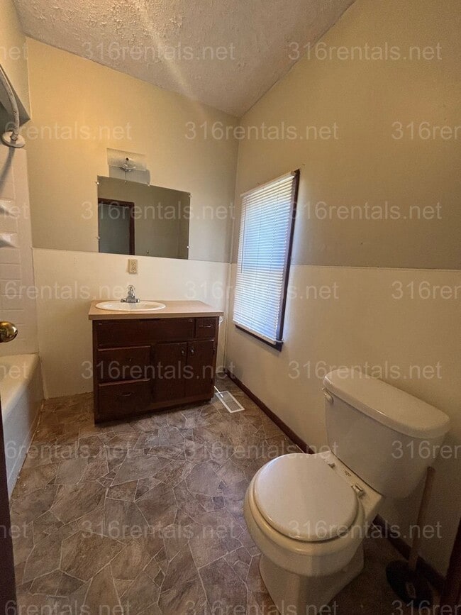 Building Photo - Two bed one bath fenced in yard house available now