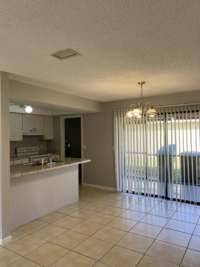 Kitchen adjacent to patio - 4629 SW 8th Pl