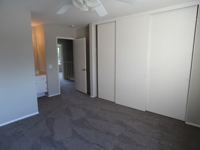 Building Photo - Two Story 4 BR 2.5 BA Condo With 2 Car Garage