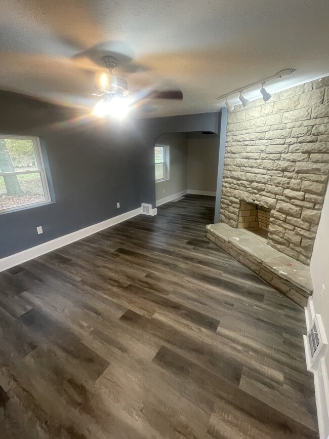 Living room with fireplace, looking towards dining room - 1710 E 296th St