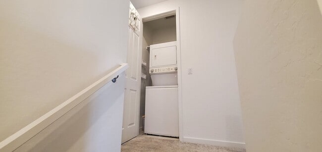 Building Photo - Beautiful townhome features a bright, open-concept layout