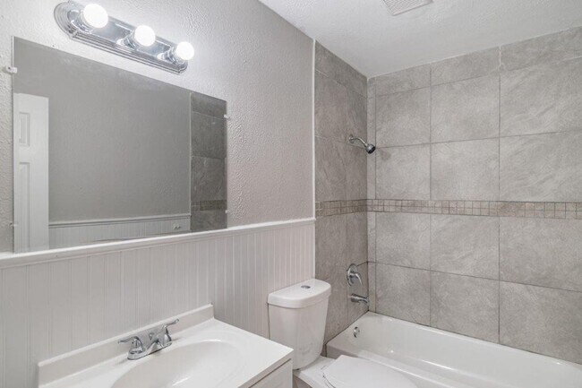 Building Photo - PRICE JUST REDUCED 3/2/1 1389 Sq. Ft. on a huge corner lot with granite & custom tile work!!