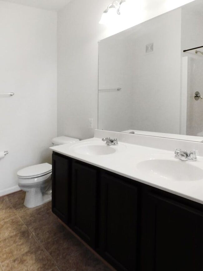 Building Photo - Pet Friendly Condo with Deck and 1 Car Garage