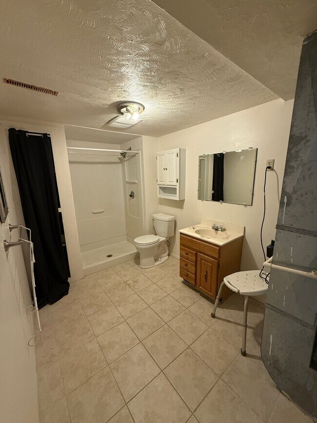 Building Photo - Spacious, four-bedroom, two-bathroom, coun...