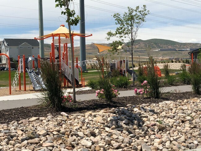 Building Photo - AMAZING HOME IN SOUGHT AFTER EXCHANGE DEVELOPMENT W/ 2 CAR GARAGE