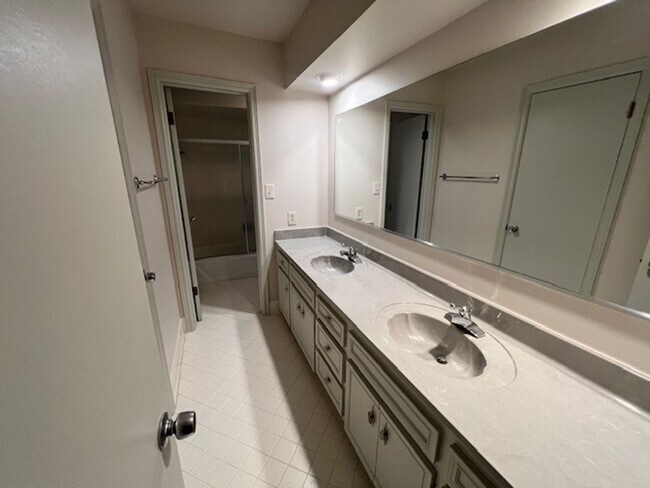 Building Photo - Step into this inviting, sunlit home where space and comfort blend seamlessly