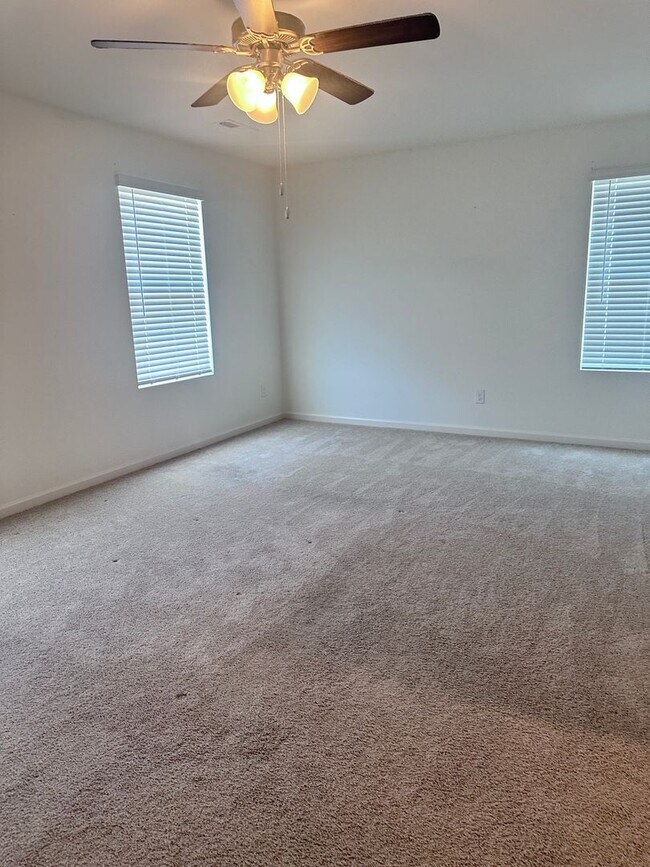 Building Photo - efficient two-level home provides a large living room, 4 very spacious bedrooms, and 2.5 bathrooms