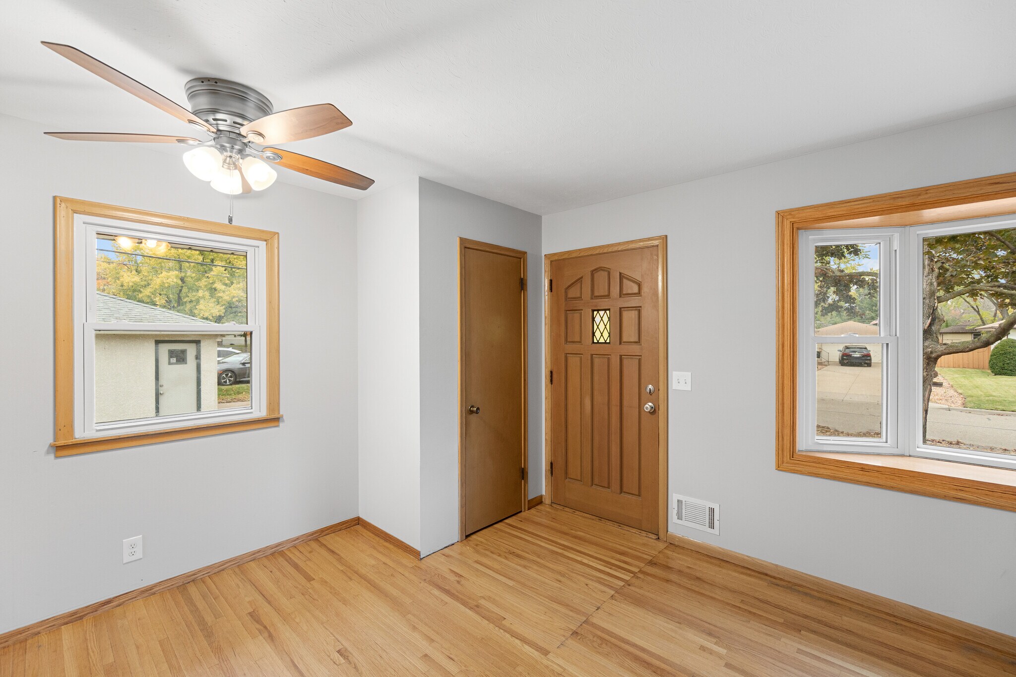 Main level entryway, solid core doors, vinyl windows & hardwood floors! - 7131 Ewing Ave N