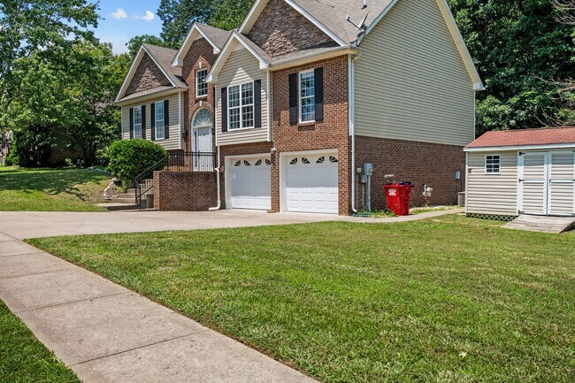Building Photo - Stunning Stone Fireplace • Finished Basement • Fenced Yard