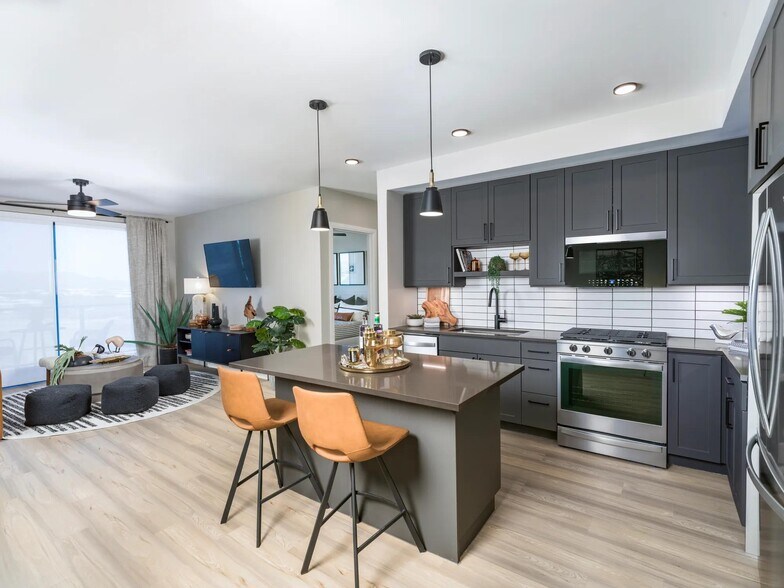 Sleek finishes, modern cabinetry, and open-concept flow—your kitchen was made for both weekday meals and weekend hosting. - Modera Scottsdale