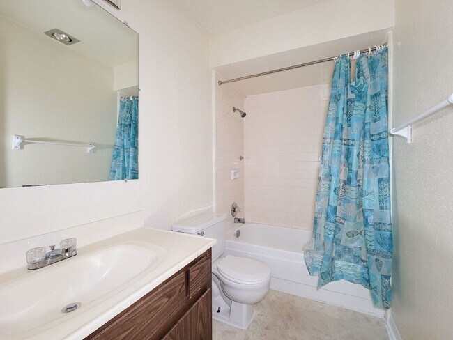 Building Photo - This stunning single-story upstairs unit o...