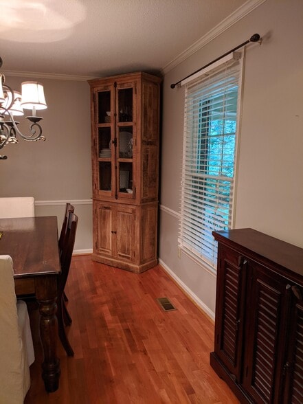 Dining room is off entry, looks out to the front yard and has hardwood floors - 303 Ferncliff Dr