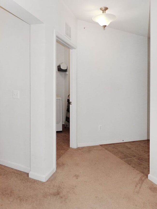 Building Photo - Pet Friendly Condo with Deck and 1 Car Garage