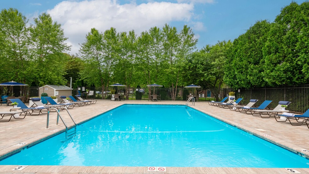 Bask in the sun on our expansive sundeck, where you can decompress on poolside loungers. - Sugarloaf Estates