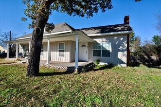 Building Photo - COMING SOON - FOR LEASE! Remodeled 2 Bedroom - 1 Bath Duplex with New Interior Paint & Wood Floors.