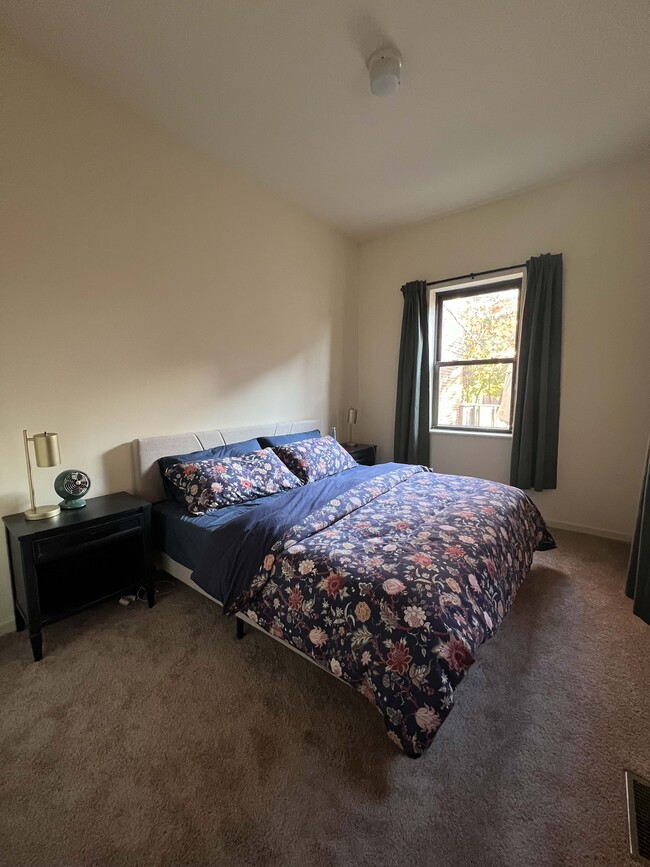 Spacious bedroom that fits a king-sized bed. - 906 Russell Blvd