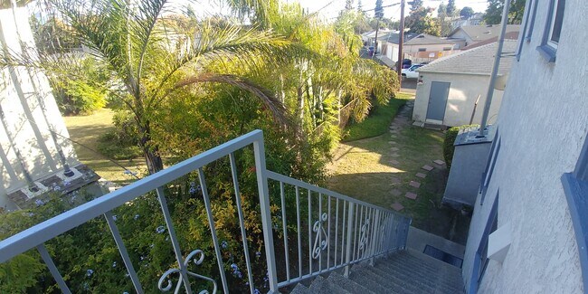 Back door stairway, side yard - 418 E Freeland St