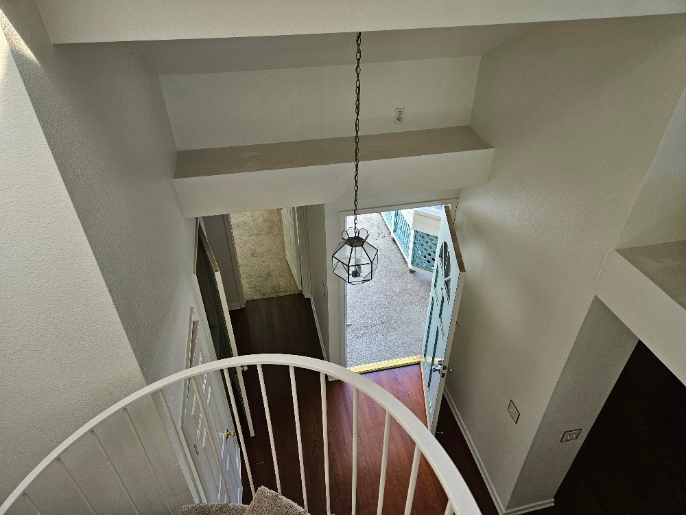 looking down from the loft to the entry - 7532 Seaspring Dr