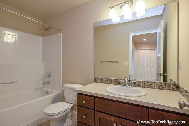 Building Photo - Spacious 4-Bedroom + Office Home in Abbey Creek – Modern Finishes, EV Charger & Low-Maintenance B...