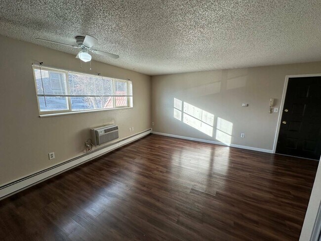 Experience open space and natural light in this beautiful living area. - Country Club