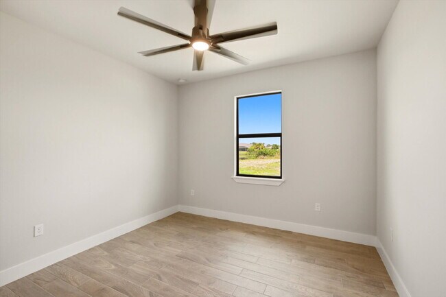 Building Photo - New 3/2 Pool Home for Rent on Canal, Fenced Yard, Pets Welcome. Your Dog Approves of This Backyard