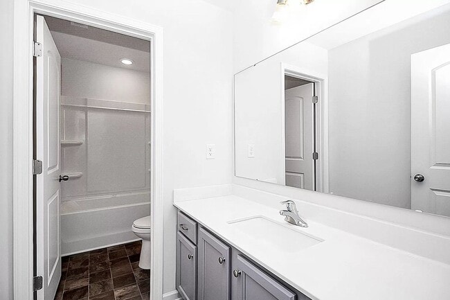 Building Photo - Home with 4 bedrooms, 3 full baths Fence in Yard