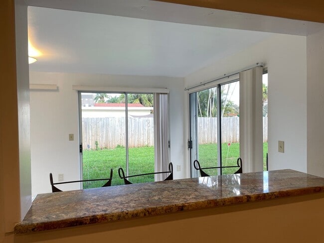 Building Photo - Easy Living in Palm Beach Gardens—Minutes ...