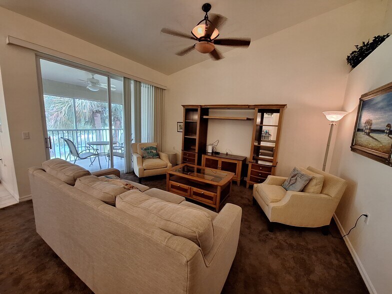 Sofa has pull out bed. Entertainment center fits large TV - 21301 Lancaster Run