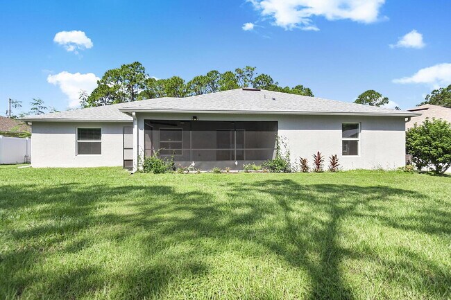 Building Photo - Modern 4-Bedroom, 3-Bath Home with Private In-Law Suite – Palm Coast, FL