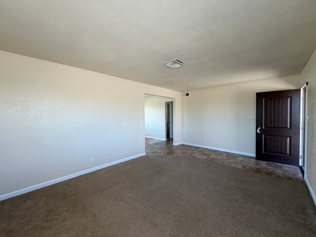 Building Photo - 3 Bedroom 2 Bathroom House with Central A/C , 2 Car Garage and Beautiful Backyard with Covered Patio