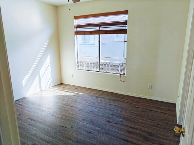 2nd floor master room, new wood looking vinyl flooring. - 900 S 94th St