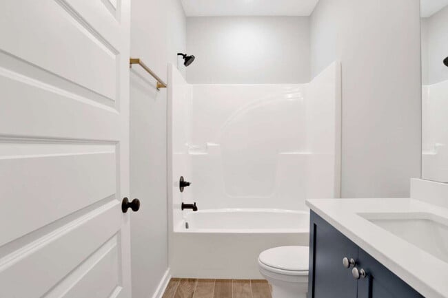 Building Photo - **Available now. This pet-friendly property features a small fenced yard with water and lawn main...