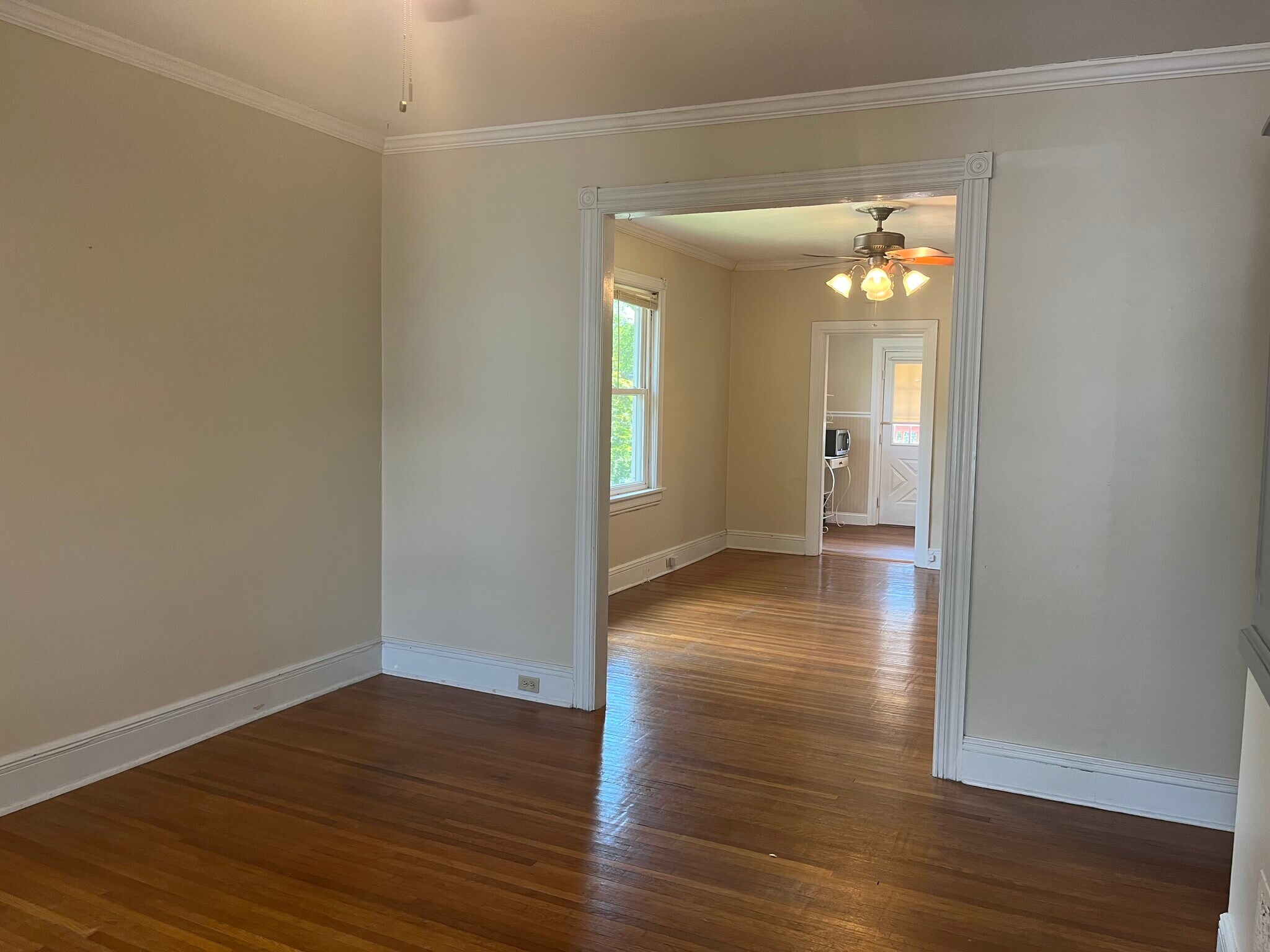 living room looking into dining room and kitchen behind - 715 Cattell St