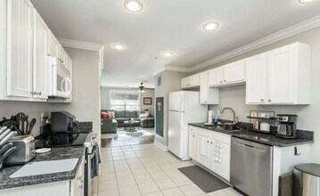 Building Photo - Two Bedrooms Available in this Three Bedroom Flat, Female Applicants!