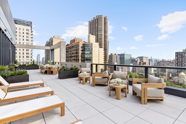 Elevate your lifestyle at The Lotus with this stunning rooftop oasis, featuring breathtaking city views and stylish lounge areas perfect for relaxation or social gatherings. Discover your new home today—schedule a tour now! - The Lotus NYC