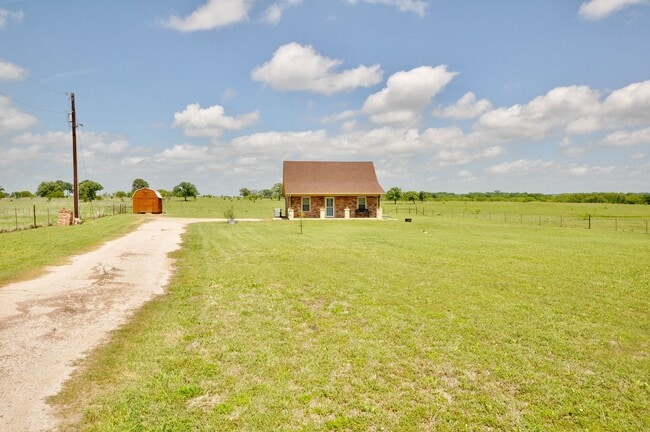 Building Photo - FOR LEASE! Enjoy Quiet Country Living in this Cute 2 BR - 1 BA Brick Home on 1 Acre in Millsap ISD.