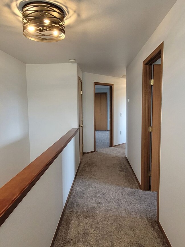 Building Photo - August Rent FREE - 4 Bedroom / Triple Car Garage
