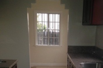 Kitchen leads to dining room - 1678 S Longwood Ave