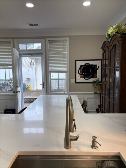 Gorgeous new quartz countertops with island table and 4 bar stools for dining. - 163 Singleton Rd