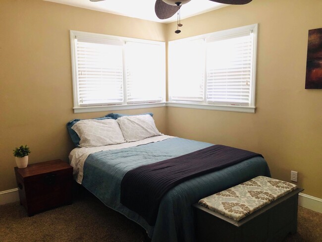 Guest room boast four corner windows for afternoon light - 2339 Kilborne Dr