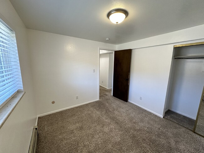 Building Photo - "Charming 3-Bedroom Condo with Hardwood Fl...