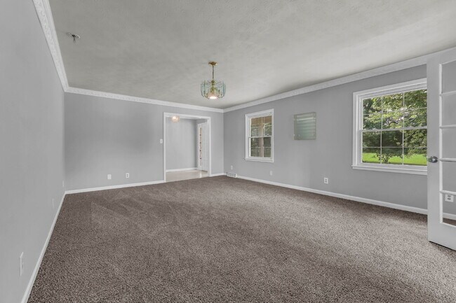 Building Photo - spacious 4-bedroom, 2.5-bath home featuring a 2-car garage and fresh updates throughout.